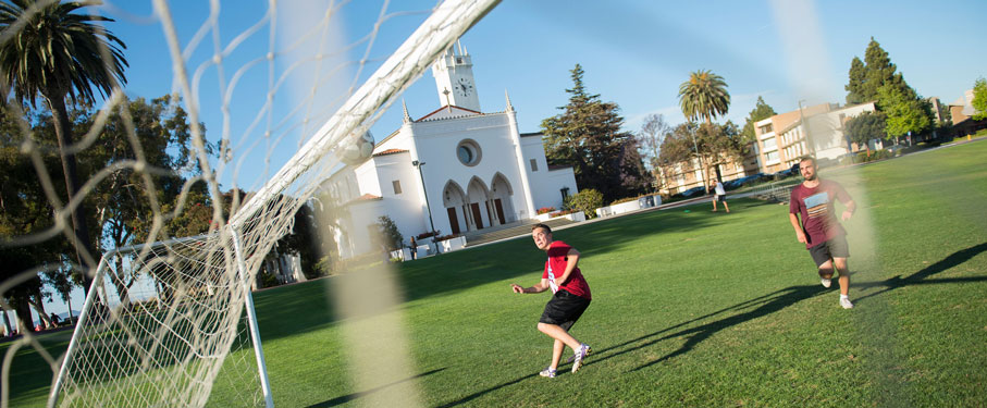 fish lens image of the soccer net featuring two lmu students