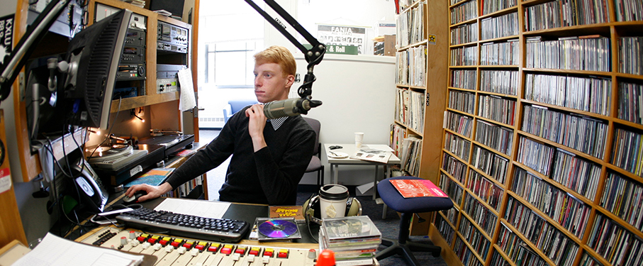 Student at the mic in the KXLU studio