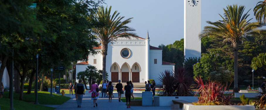 Students walking in front of the Sacred Heart Chapel.