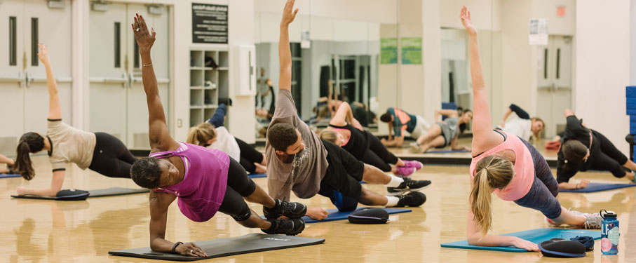 a group of members taking a group fitness class