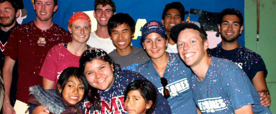 lmu students with children from De Colores organization