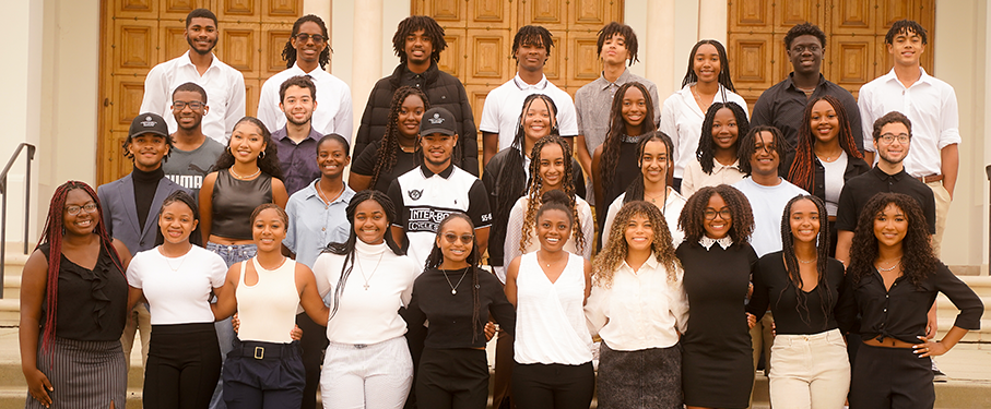 Students from TLC pose on the steps of Sacred Heart Chapel