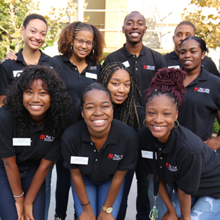 Students gather for an event with The Learning Community outside.