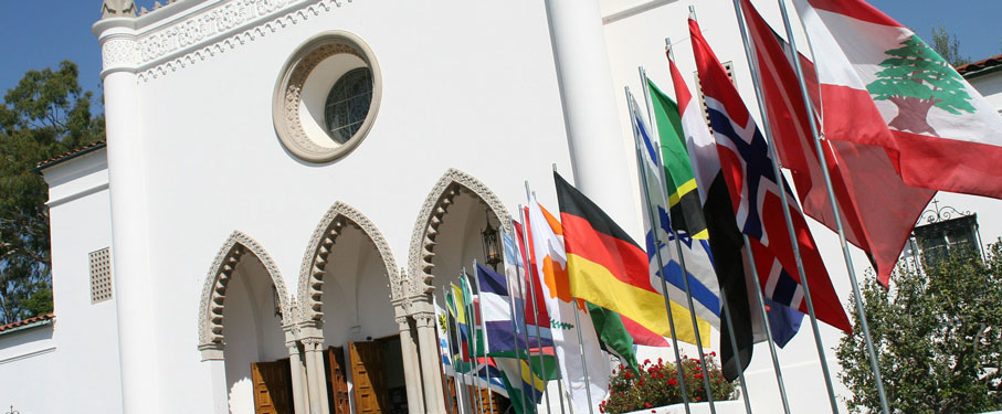 International flags in front of the school's chapel.