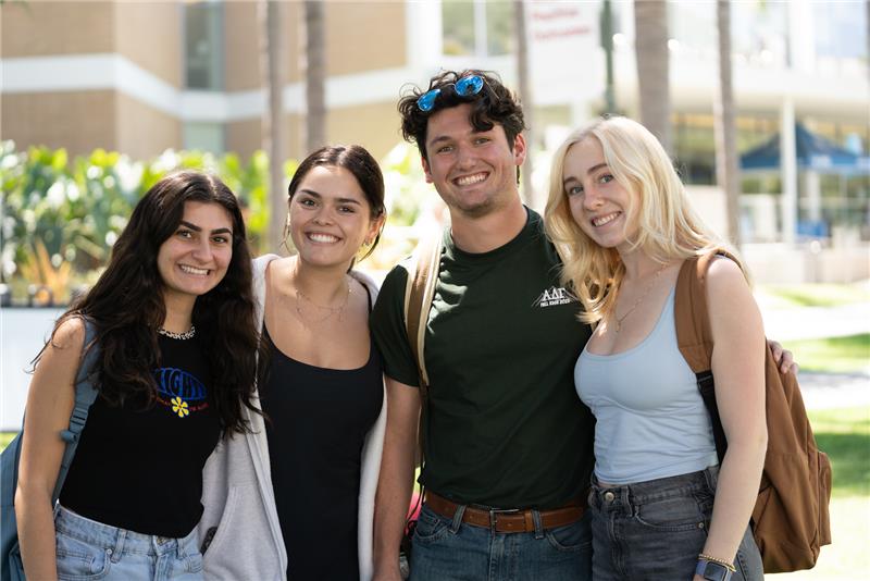 A group of students smiling in front of VDA