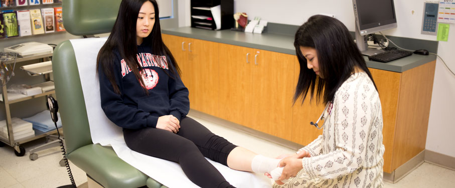 lmu shs student health services student receiving care on ankle sprain by shs medical professional