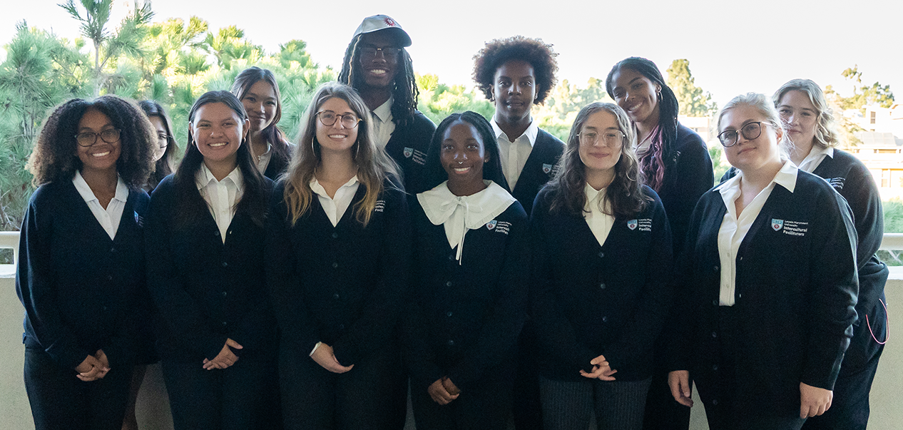 Intercultural Facilitators dressed in their sweaters to facilitate an on-campus discussion.