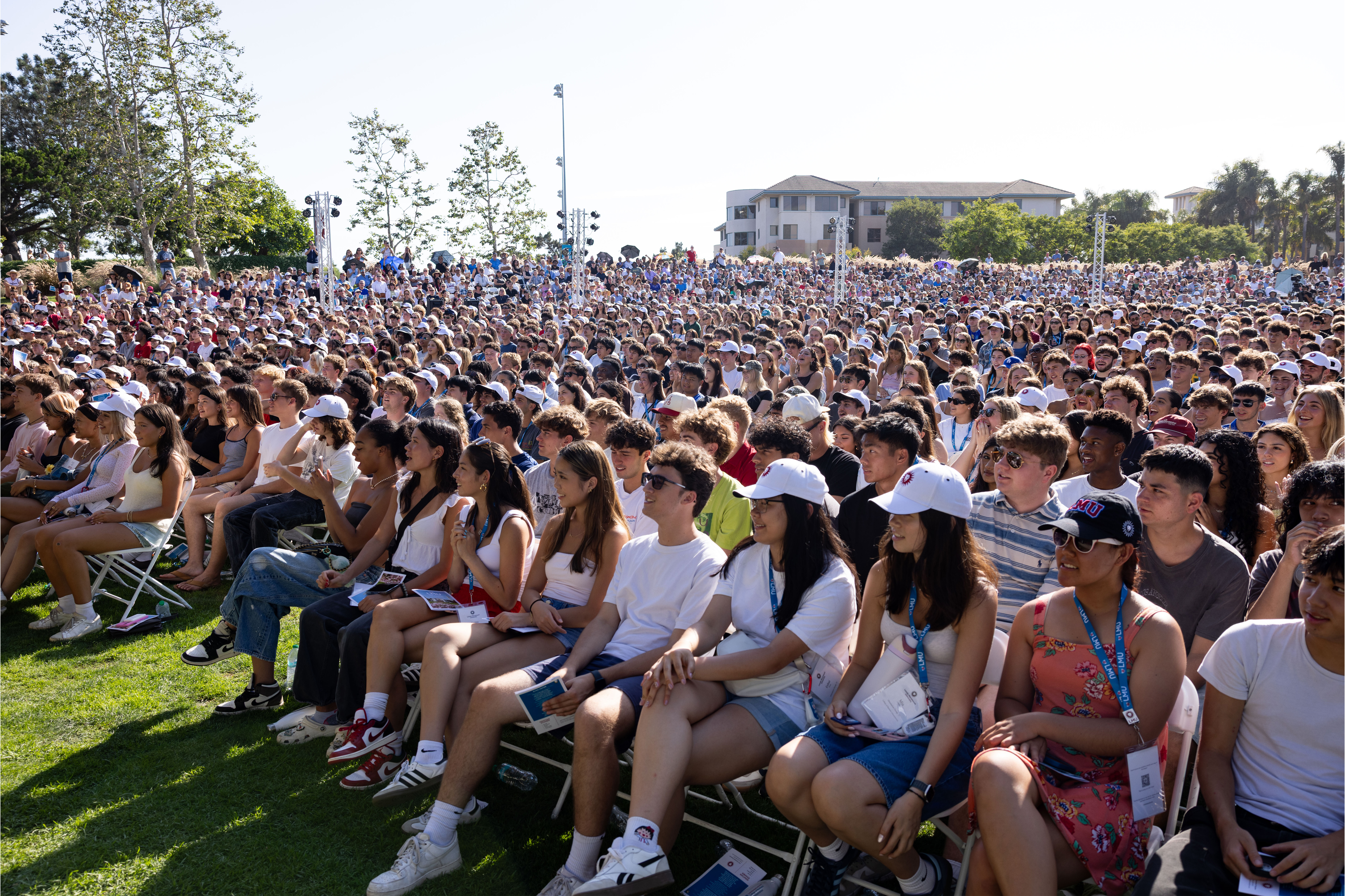 A large crowd of news students and their families gather on Lawton Plaza for New Student Convocation on Drollinger Family Stage